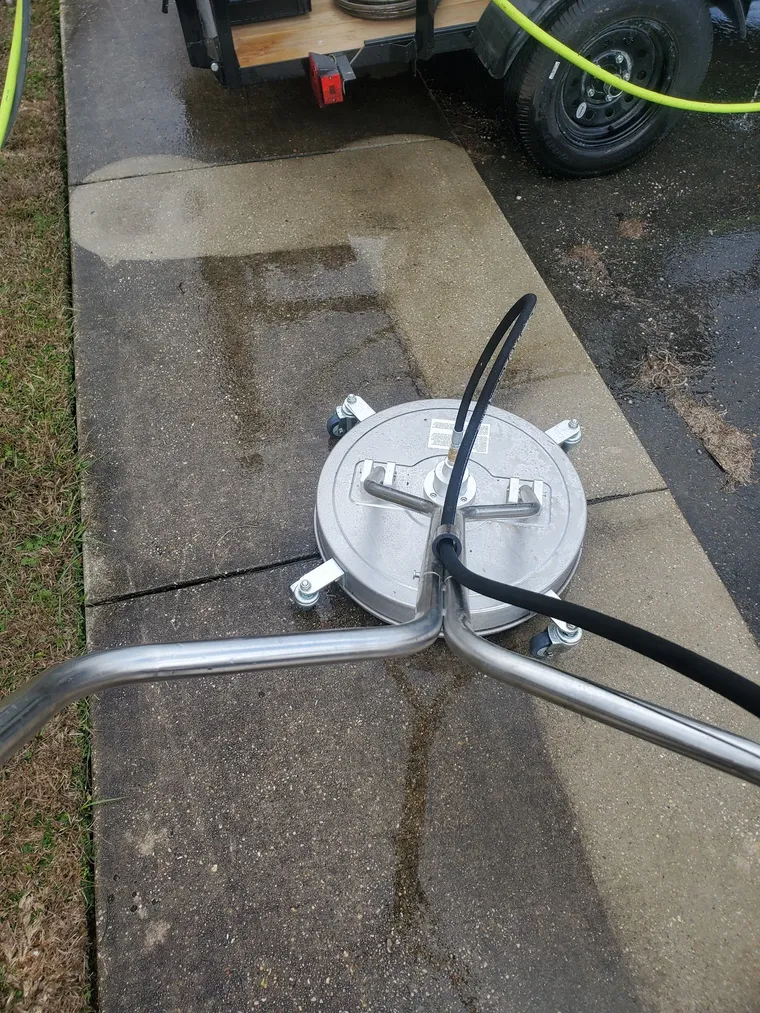 Our surface-cleaner attachment on a concrete walkway