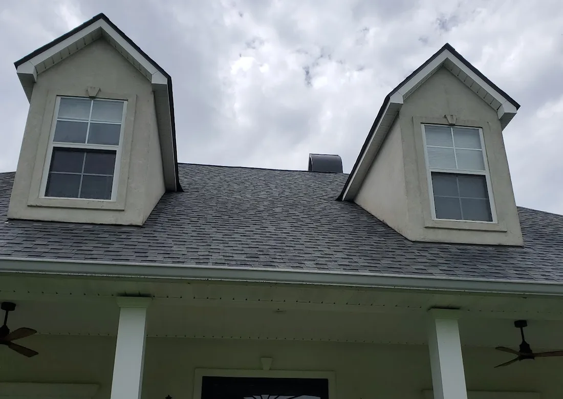 A home's roofline, gutter and soffit after a full exterior wash