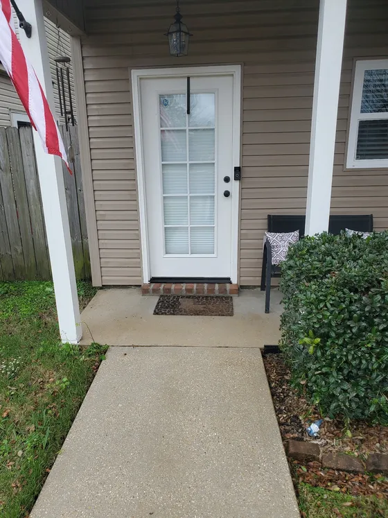 A clean front walkway after Delta Exterior Washing